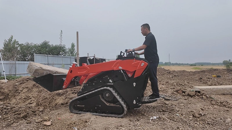 Skid loader is transporting large cement slab